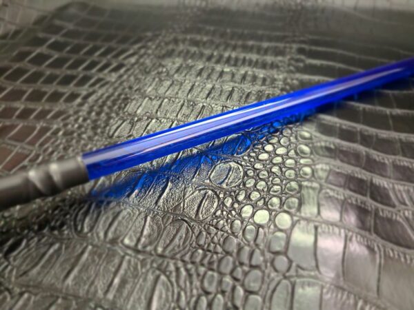 Blue acrylic rod against alligator faux leather