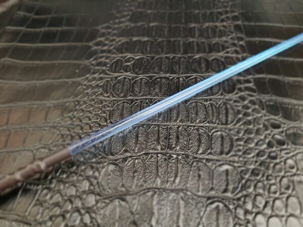 Neon Blue acrylic rod against alligator faux leather